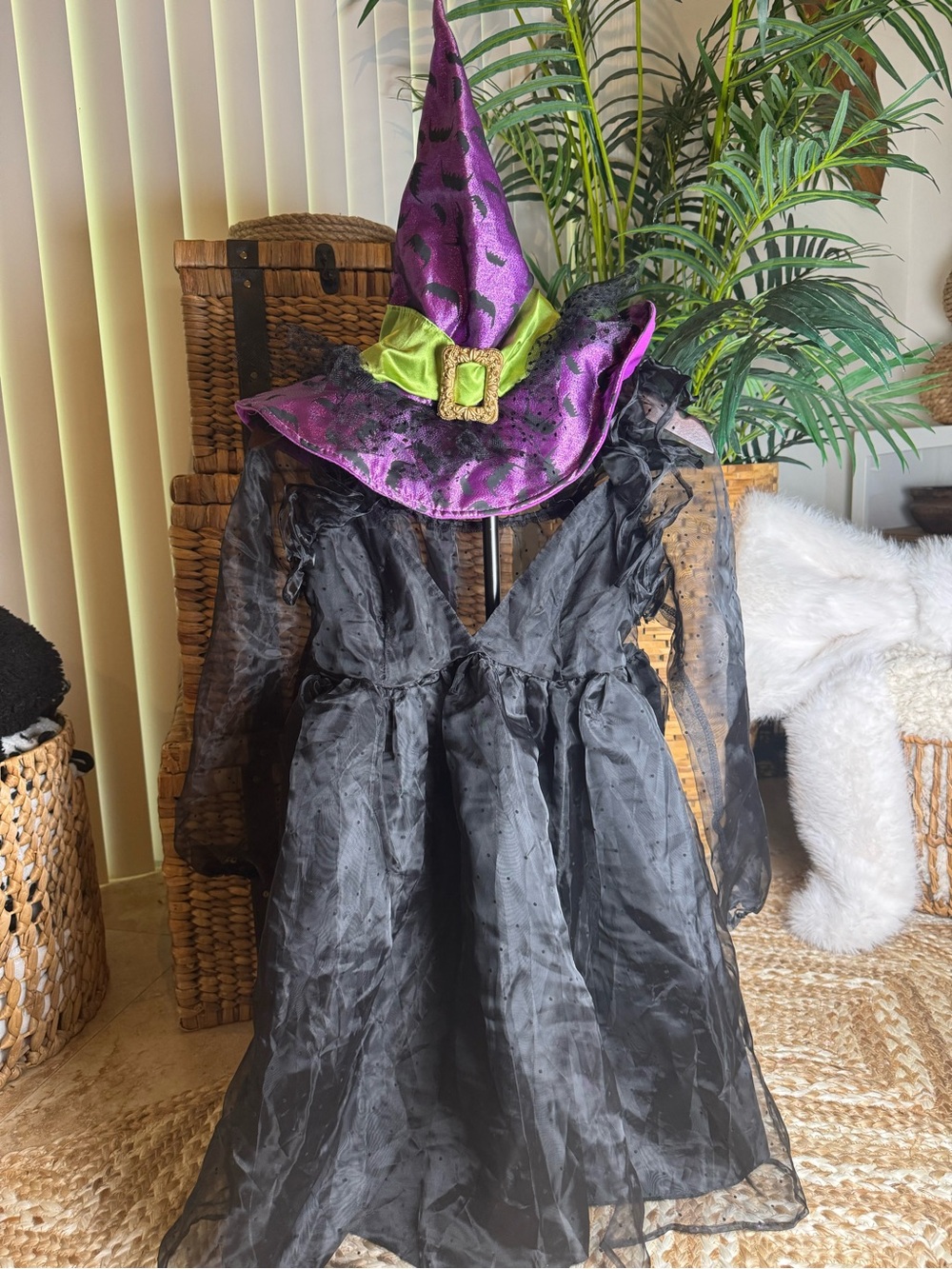 Woman’s black polka dot tulle dress with matching purple/green/gold hat ..
